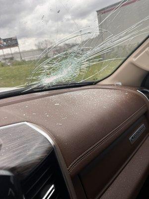 My windshield they damaged from a brick that came off their truck.