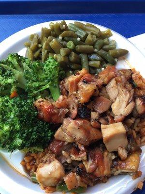 Bourbon chicken on top of what is supposed to be jambalaya and two veggie sides.