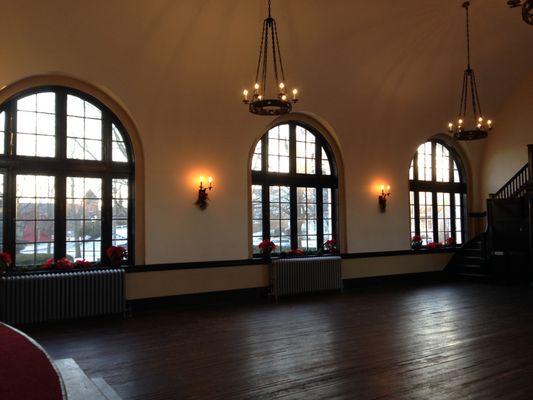 Three large windows in the Main Hall flood the space with natural light, and open to the adjacent patio.