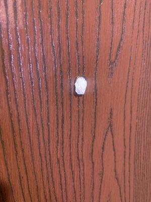 This is a photo of a tissue stuffed into my peephole. I am a single woman. What the heck. Unbelievable.