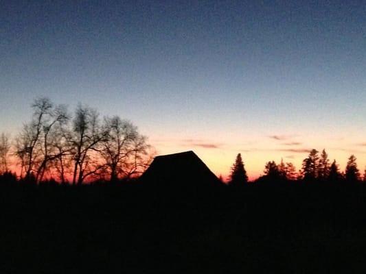 Sunset with a view of the signature barn on the property