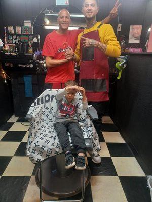 Another happy customer at the Shark Tank Barbershop