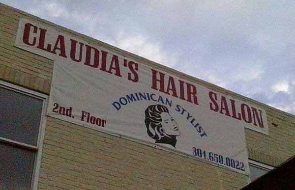 Building Sign. It looks like Claudia Jordan from "Deal or No Deal" and "Celebrity Apprentice" ~