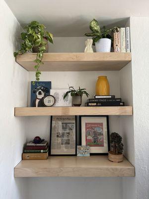 Left side of floating shelves with some Knick knacks