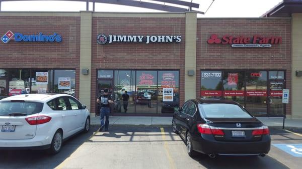 Delivery boy running into store to get next order.