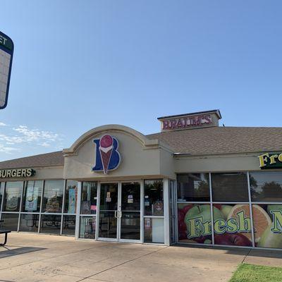 Braum's front/street view with ample signage for their fresh market and promotional offers.