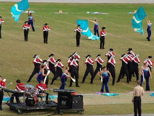 Learn to play drums for a marching band.