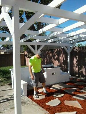 patio rehab after - removed broken concrete and bricks, replaced rotten rafters and added cross braces for support. Painted.