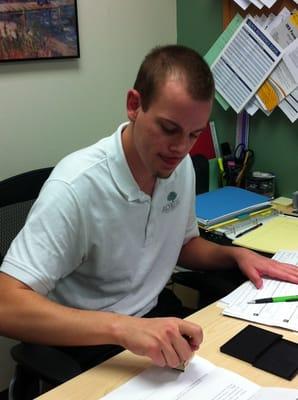 We now offer notary services.  Here's Mike notarizing a document for a client.
