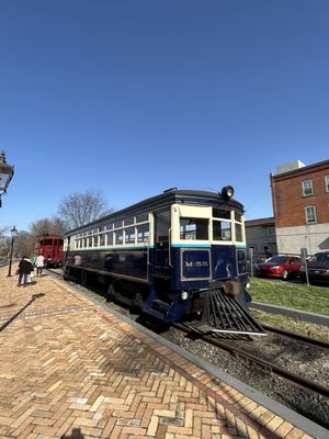 Trolley and caboose on the other side of the Main Street. Nicely restored