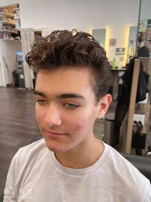 Nice tidy cut with curls on this Young Man from France .