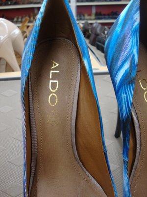 Inside markings on the neon blue shoes.