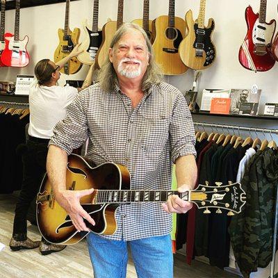 The Local Pickup's new pal holding his new hollow body electric guitar.