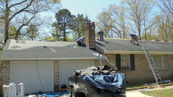 A photo of our crew installing a new shingle roof.