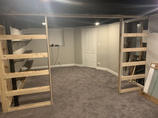 New gaming room created in this basement with pocket doors added to help with lighting in the room