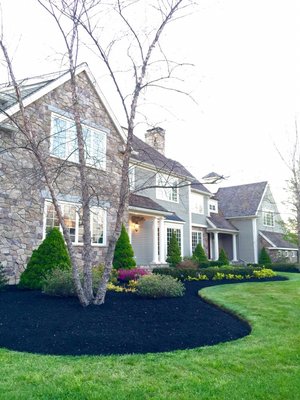 Perfect edging and black mulch professionally installed.