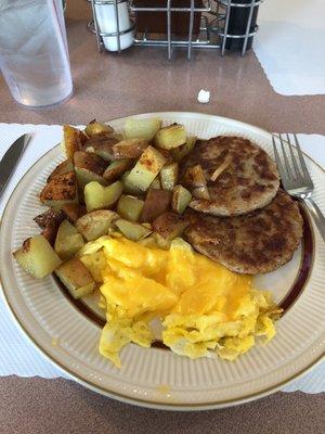 Scrambled egg with cheese. Home fries. Sausage.