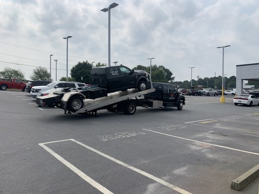 Towing a hot shot truck and trailer.