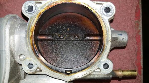 Throttle body before cleaning, vehicle would stall when stopping