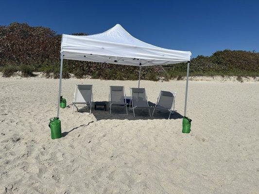 Large Canopy with chairs and small table.