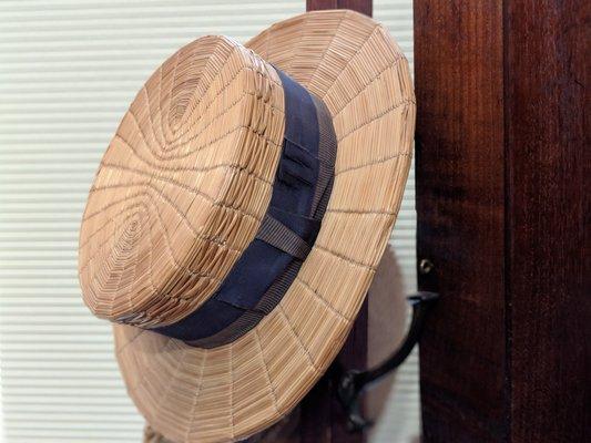 A straw hat in the upstairs exhibit.