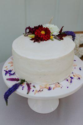 Our dairy, gluten, nut, & soy free funfetti wedding cake. Mickey worked w/ our florist to decorate it w/ our flowers.(pic by Makenna Smith)