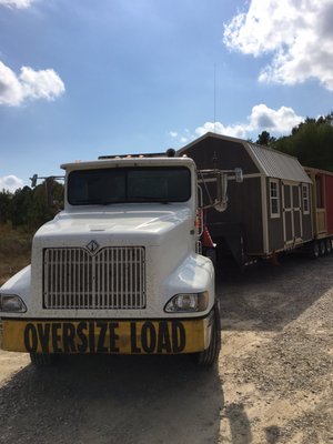 Trucks bringing Premier Portable Buildings