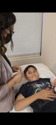 Patient getting treated by Dr. Boravy Muong-Keo.