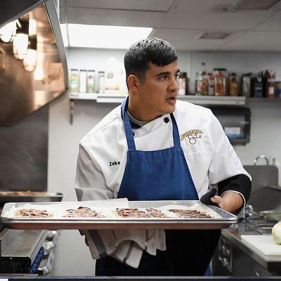 Owner, Zeke, whippin up the work in the kitchen