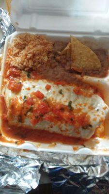 Burrito suizo loaded with diced tomatoes and sauce. Rice and beans with 4 chips. Total price $9.95