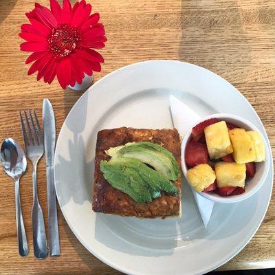 Chorizo potato frittata with avocado. Fresh fruit on the side.