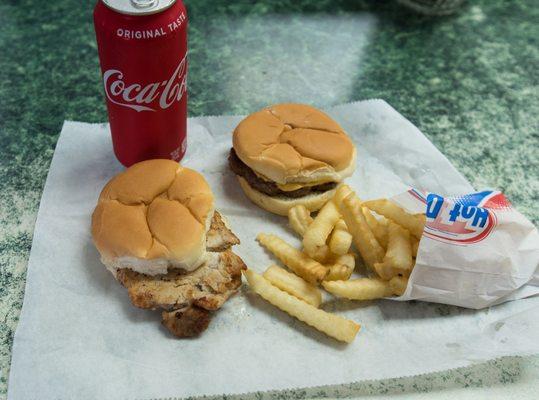 Pork tenderloin sandwich with plain cheeseburger and fries