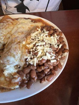 Chicken enchiladas with green peppers,  mushrooms with rice and beans