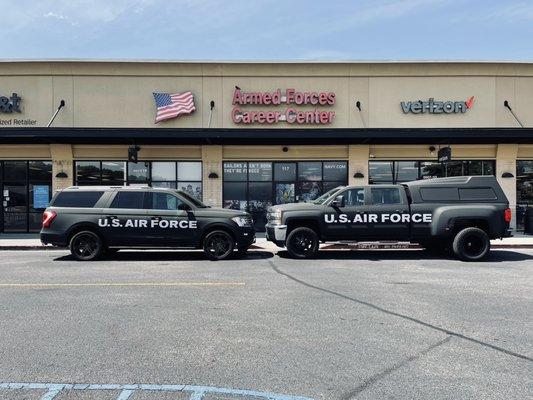 Office front with marketing vehicles.