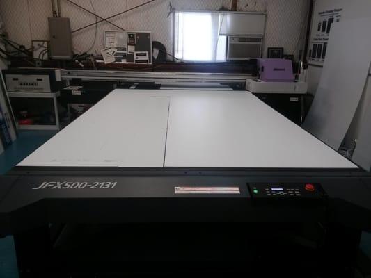 Our New Flatbed printer. We can now print 82 x 122 inches. With UV cured inks, your sign is dry when it comes off the printer.