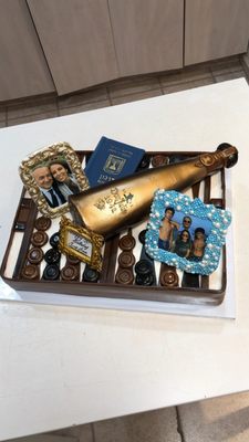 Play backgammon cake with a hey Don Julio wine bottle cake and family pictures