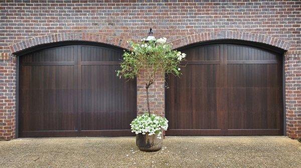 Completely custom hurricane-rated wood garage doors by CAMBEK