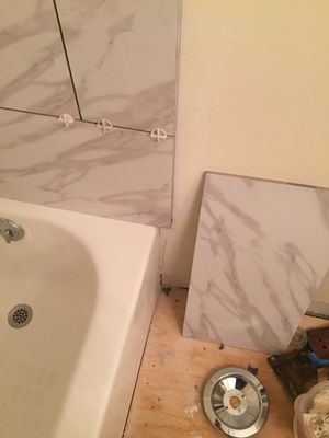 These poorly cut tiles belong on a floor not a Sheetrock tiles shower.