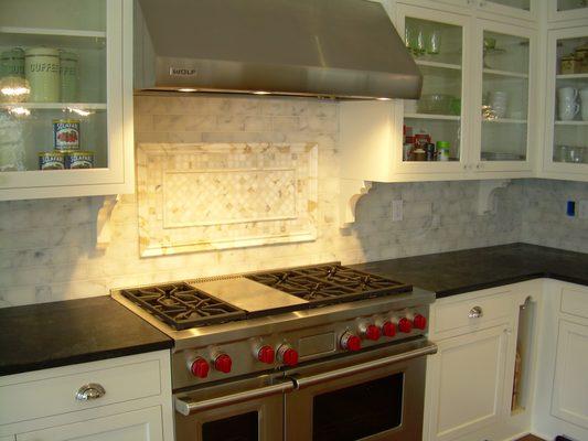 Full custom Kitchen with beautiful marble backsplash.