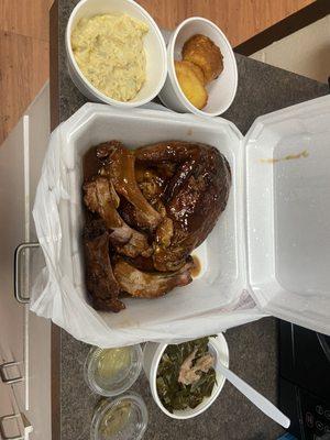 Chicken and ribs. Potato salad and corn bread muffins. Amazing  collared greens