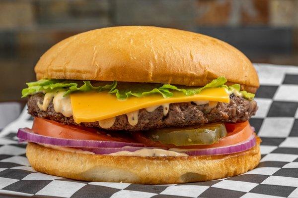 QuarterBack Burger:
8oz Angus beef burger patty with our signature dressing, tomatoes, pickles, onions, lettuce and cheese.