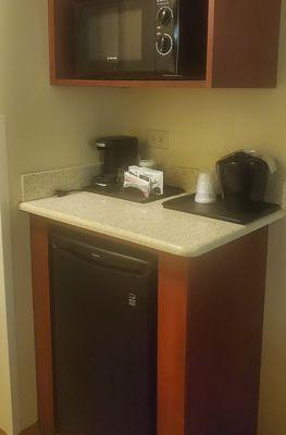 Nice convenience station with coffee service and fridge.