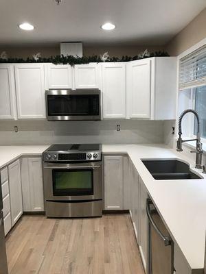 Kitchen re-facing, backslash and hardwood floor