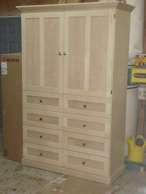 8 small drawers 2 doors armoire of maple veneer and solid. 48"wx19"dx78"h.