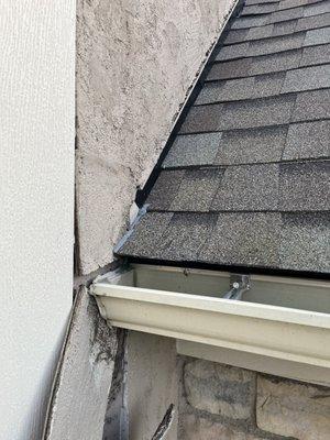 Caulk where flashing should be causing water to get behind stucco and fall off.