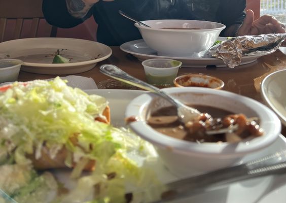 Chicken taquitos and frijoles Menudo