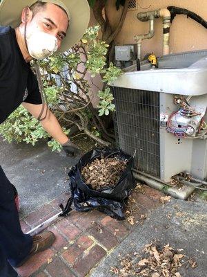 Dan showing me all of the debris he cleaned out of the condenser. It had not been cleaned out in over 10 years.