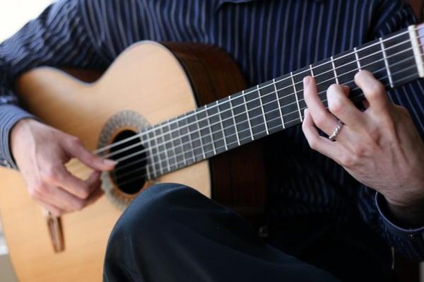 Anthony Cutietta performing classical guitar.