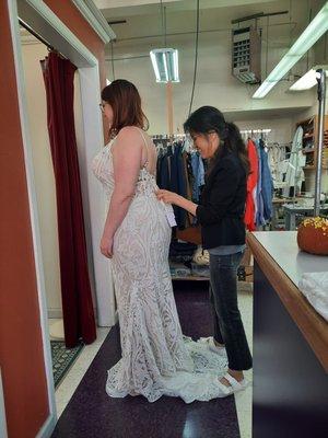 At Superb Custom Tailors, Misook one of the owner helping her customer with a smile