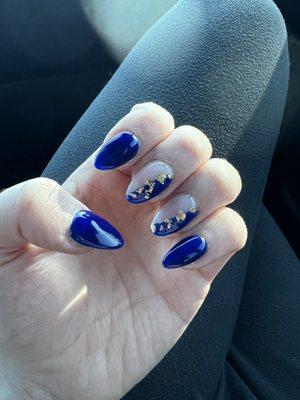 Blue acrylic nails with gold flakes